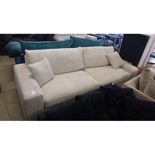 1645 - A cream jumbo corduroy 4.5 seater sofa with footstool - marked