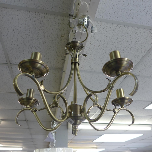 1437 - A gold five arm chandelier