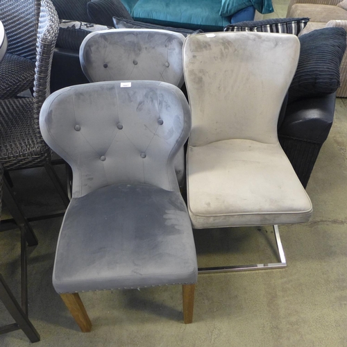 1667 - A pair of Arlo grey button back velvet chairs and a Hugo taupe velvet chair - damaged *This lot is s... 