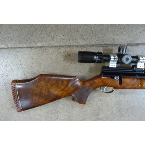 827A - A Webley Axsor cal. 5.5 target shooting air rifle with Sidewinder 8.5-34x52 scope and soft case