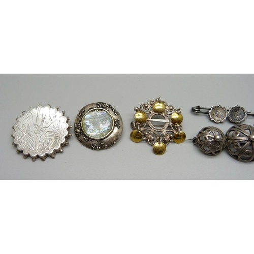 1002 - Six silver brooches including Norwegian marriage brooch, 42g