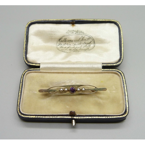 1010 - A 15ct gold, amethyst and pearl brooch in an antique fitted box, 2.2g, 4.4cm