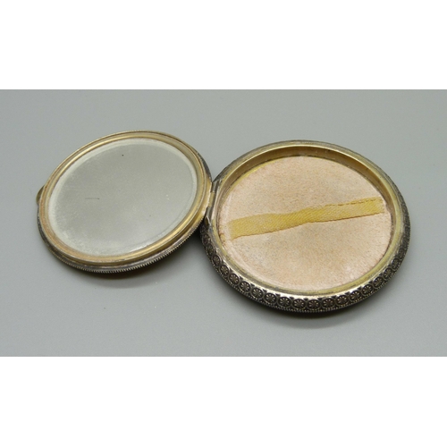 1027 - A white metal and yellow guilloche enamel compact, small area of wear to the enamel near hinge