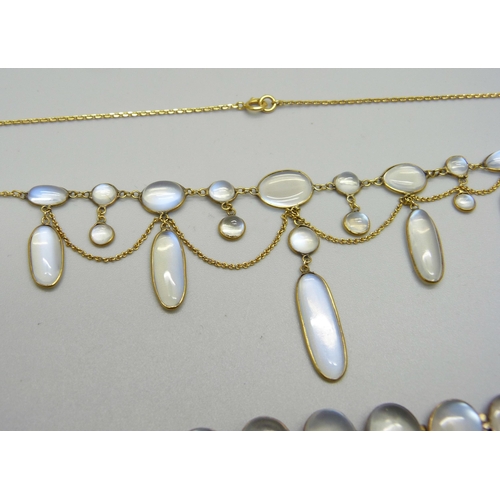 1038 - A 9ct gold and moonstone drop necklace, and a yellow metal moonstone set bracelet with a plated fast... 