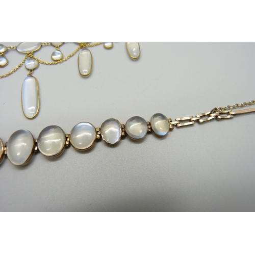 1038 - A 9ct gold and moonstone drop necklace, and a yellow metal moonstone set bracelet with a plated fast... 