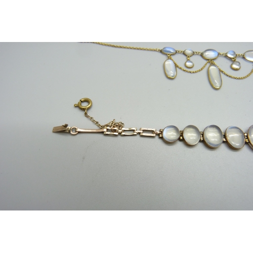 1038 - A 9ct gold and moonstone drop necklace, and a yellow metal moonstone set bracelet with a plated fast... 