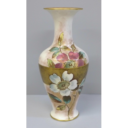 609 - A Doulton Christmas Rose faience vase, registration lozenge to base, 19.5cm