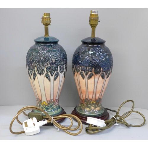 613 - A pair of Moorcroft Cloony table lamps, 30cm