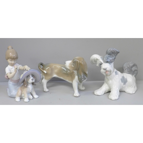 617 - Two Lladro figures of dogs, one a/f and one figure of a girl playing with a dog