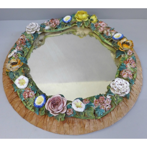 619 - A Derby porcelain encrusted mirror, retail label to back