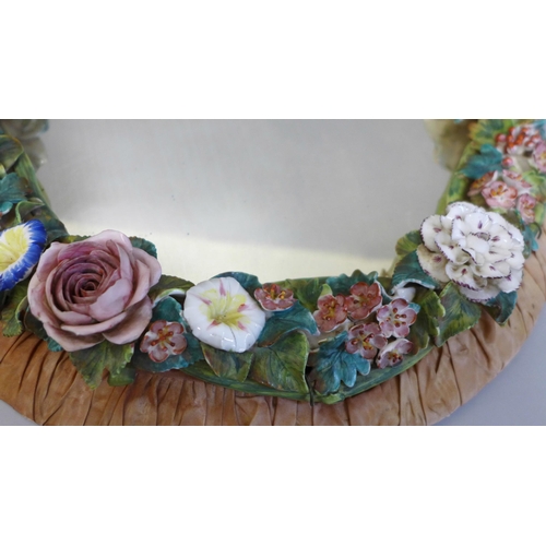 619 - A Derby porcelain encrusted mirror, retail label to back