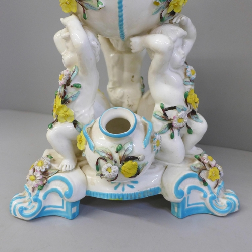 621 - A Minton porcelain cherub centrepiece, a/f