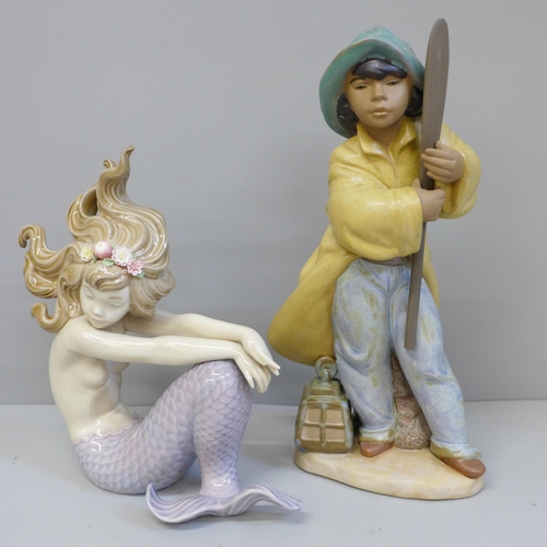 634 - A Lladro Mermaid and Young Fisherman figure