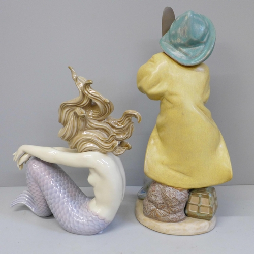 634 - A Lladro Mermaid and Young Fisherman figure