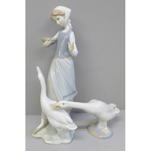 648 - A Lladro figure of women tending to geese and another Lladro goose figure, a/f