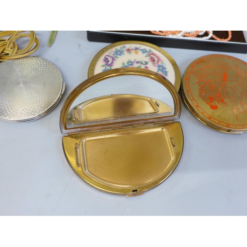 654 - Compacts including one silver and a coral necklace and bracelet with 14ct gold clasps