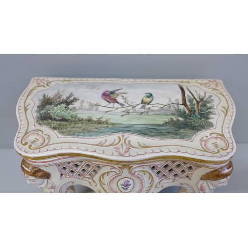 662 - A French hand painted pottery jewellery casket