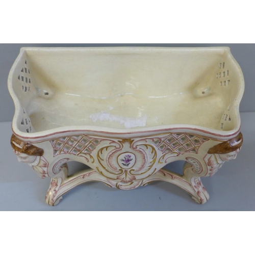 662 - A French hand painted pottery jewellery casket