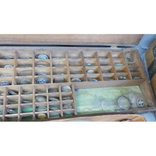 675 - A collection of watch glasses and another box containing trench watch glasses