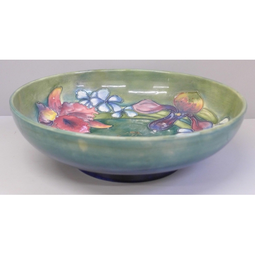 682 - A Moorcroft Orchid pattern bowl, crazed, 27cm