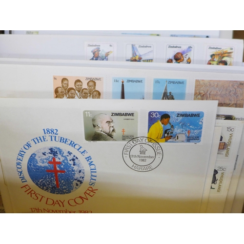 698 - Stamps; a box of covers in albums (World Wildlife Fund and Princess Diana) together with loose first... 