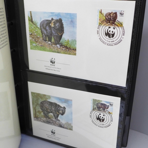 698 - Stamps; a box of covers in albums (World Wildlife Fund and Princess Diana) together with loose first... 