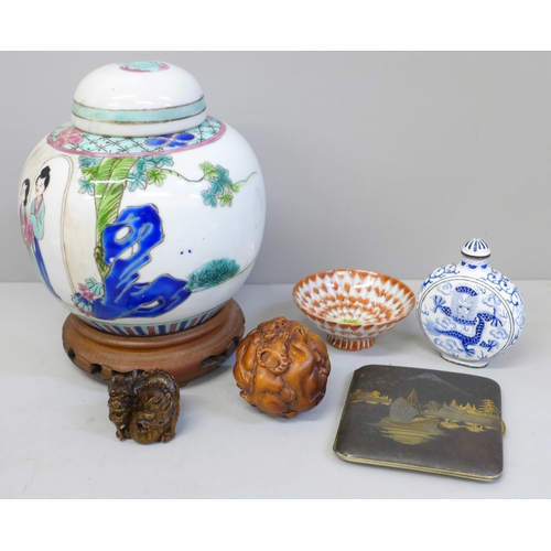 717 - Six oriental items including two netsukes, ginger jar and cigarette case