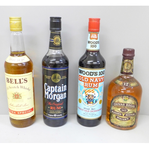 718 - Four bottles of alcohol; Captain Morgan Original Rum, Woods 100 Old Navy Rum, Chivas Regal Scotch Wh... 