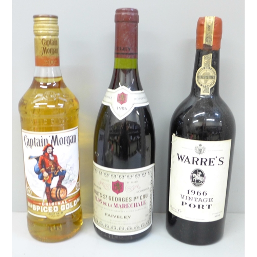 719 - Three bottles:- Warre's 1966 Vintage Port, Captain Morgan Spiced Gold Rum and Nuits St. Georges 1er ... 