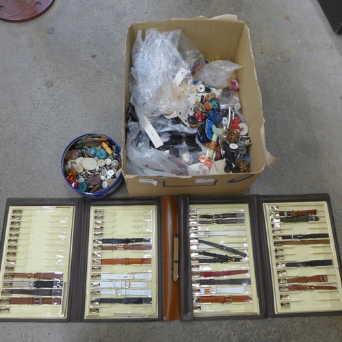 734 - A box of vintage buckles, buttons and a folder of watch straps