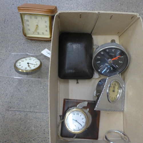 739 - An 8-days clock on a Perspex stand, three other clocks including chrome plated