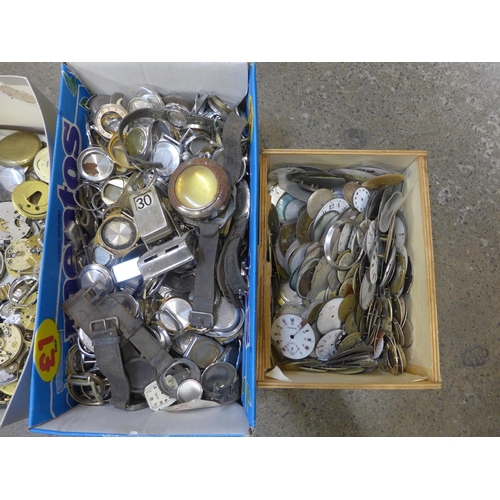 749 - A box of wristwatch case backs and bezels and a collection of pocket watch dials and parts