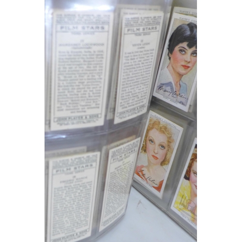 802 - Cigarette cards; an album containing twelve complete sets of Players cards including Poultry, Britis... 