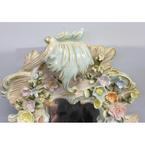 807 - A German porcelain cherub wall mirror