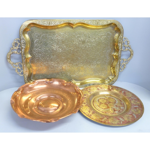 819 - A two-handled brass tray, copper bowl and brass plate or tray