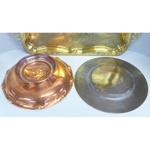 819 - A two-handled brass tray, copper bowl and brass plate or tray