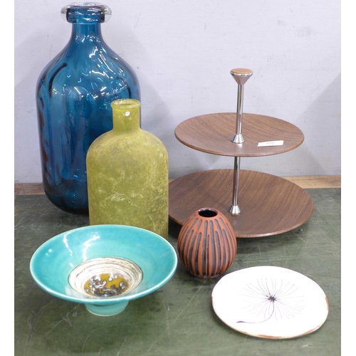 820 - A small Poole pottery vase, a studio pottery bowl, a large blue glass bottle, a cake stand, etc.