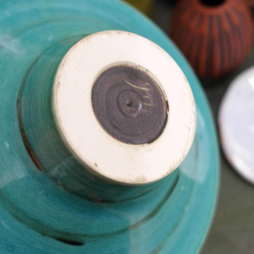 820 - A small Poole pottery vase, a studio pottery bowl, a large blue glass bottle, a cake stand, etc.