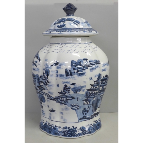 822 - An English oriental style blue and white lidded vase, 44cm