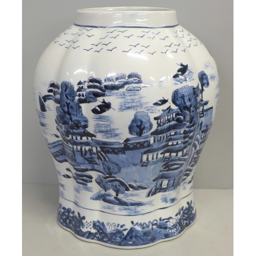 822 - An English oriental style blue and white lidded vase, 44cm