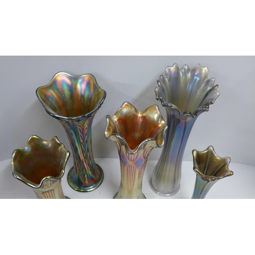 825 - Two Fenton diamond and rib carnival glass vases and three others