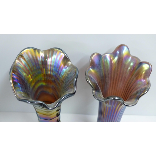 828 - An Imperial Glass Company ripple carnival glass vase and a Northwood fine rib iridescent glass vase