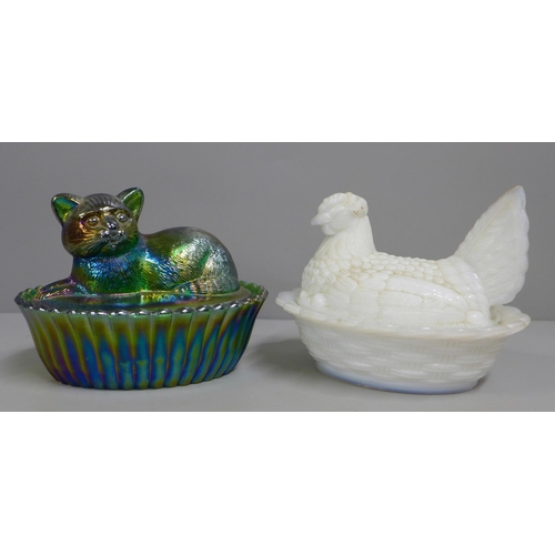 835 - A Westmorland Glass Company iridescent cat on basket and a milk glass hen on basket