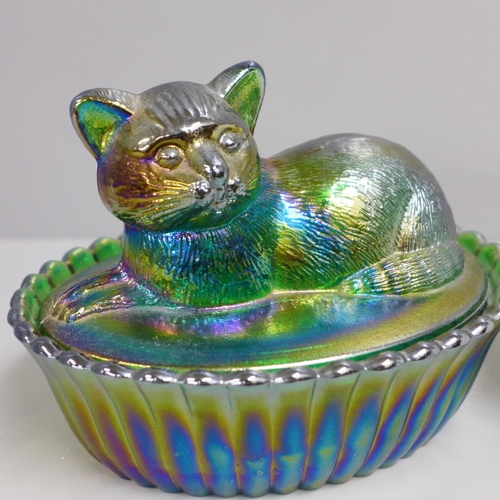 835 - A Westmorland Glass Company iridescent cat on basket and a milk glass hen on basket