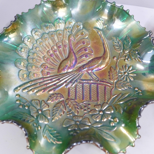 845 - A Northwood Peacocks on Fence green carnival glass dish and a Fenton iridescent Stags and Holly carn... 