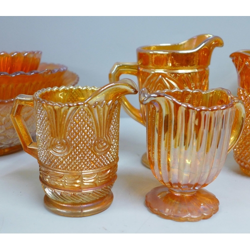 854 - Ten items of marigold carnival glass, five jugs/pitchers, two pedestal bowls, other bowls including ... 