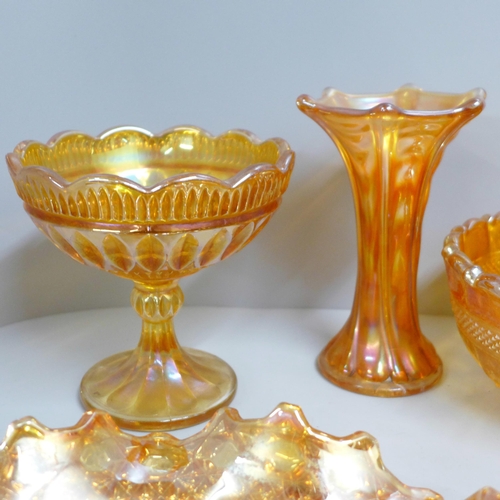 855 - Ten items of marigold carnival glass including a large oval bowl and a small vase **PLEASE NOTE THIS... 