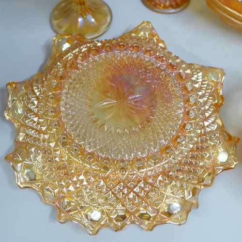 855 - Ten items of marigold carnival glass including a large oval bowl and a small vase **PLEASE NOTE THIS... 