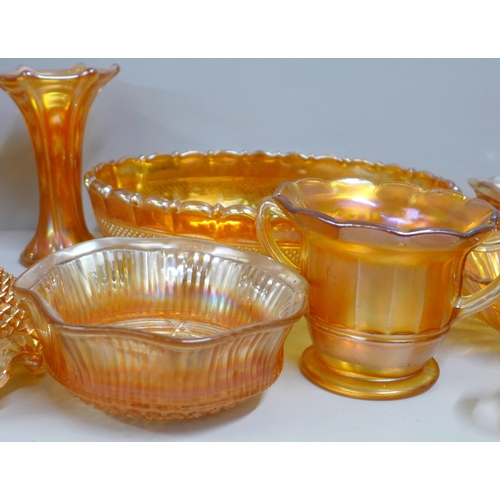 855 - Ten items of marigold carnival glass including a large oval bowl and a small vase **PLEASE NOTE THIS... 