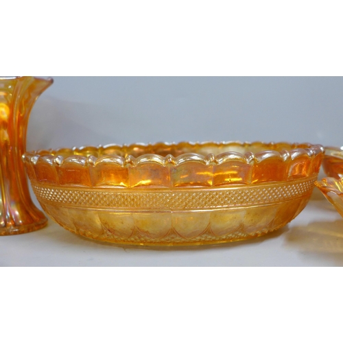 855 - Ten items of marigold carnival glass including a large oval bowl and a small vase **PLEASE NOTE THIS... 